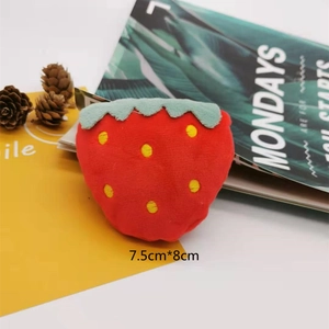 Detailed view of a soft strawberry plush accessory with size dimensions of 7.5cm by 8cm