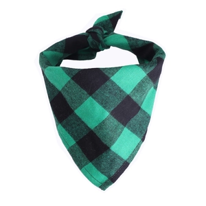 Detail of green and black plaid cotton pet bandana showing woven texture and knot