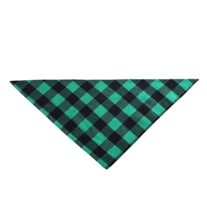 Detailed view of green and black checkered pattern cotton fabric on dog bandana accessory