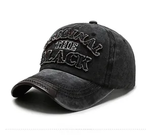 Detail of vintage washed cotton baseball cap with 3D embroidery and leather-edged brim
