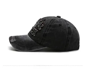 Detailed close-up of charcoal gray washed cotton fabric and premium 3D embroidery on cap