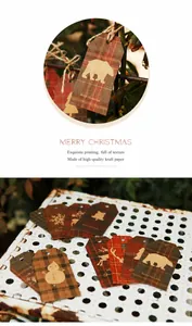 Detailed view of Christmas kraft paper gift tags with plaid patterns and gold foil motifs