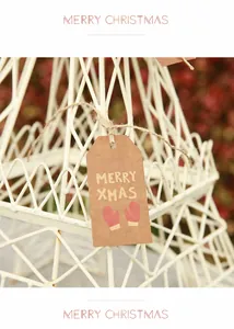 Detail of kraft paper Christmas gift tag with red glove print and Merry Xmas text