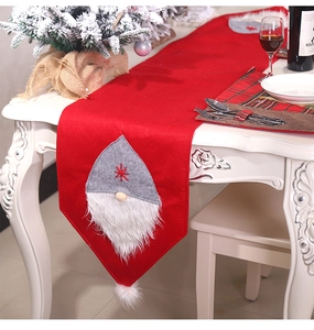 Festive red felt table runner with 3D gnome design and snowflake embroidery detail