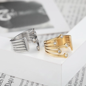 Minimalist multi-layer open ring with silver and gold finishes and clear zircon accents