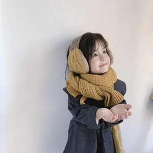 Detail of kids knit earmuff and diamond scarf set in ginger and camel color blocking