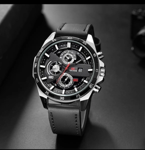 Macro view of men's sports watch dial featuring chronograph sub-dials and date window