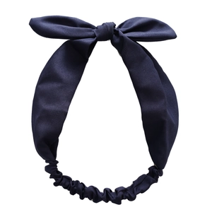 Elastic rabbit ear headband in navy blue fabric with knotted bow for women