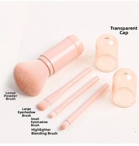 Macro shot of 4-in-1 pink makeup brush set including powder and eyeshadow brushes