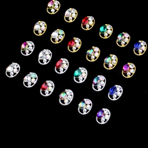 Oval gemstone nail charms with pearls and twisted metal frames in gold and silver