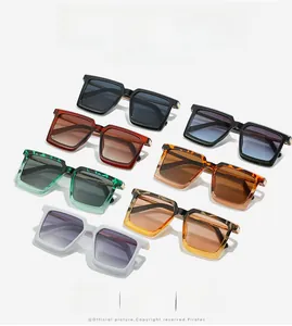 Detailed close-up of square sunglasses with metal hinges and multiple color options