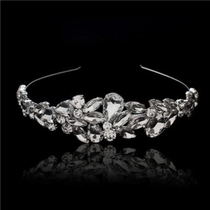 Detailed view of bridal silver leaf tiara with sparkling crystal rhinestones and mirror reflection
