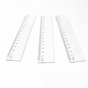 Detailed view of three 15cm transparent plastic rulers with clear metric scales
