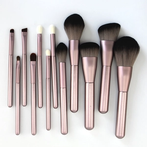 Detail of 12-piece soft lilac makeup brush set with rose gold handles on white background