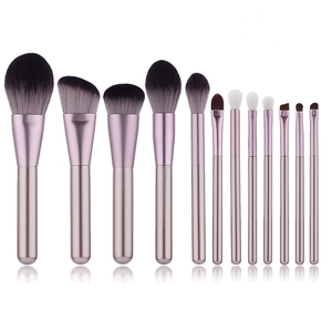 Close-up of 11-piece makeup brush set with rose gold handles and soft bicolor bristles