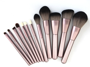 Detail of 11-piece makeup brush set with rose gold handles and synthetic bristles