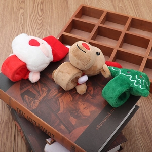 Plush Christmas slap bracelets with reindeer and Santa claus on vintage books