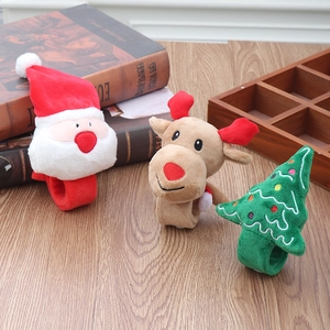 Detailed plush texture of Christmas snap bracelets featuring Santa, tree, and reindeer designs