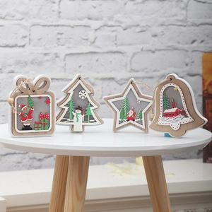 Set of four lighted wooden Christmas ornaments with star, tree, bell and gift box shapes