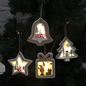 Detail of wooden Christmas pendants with warm LED lights in various holiday shapes