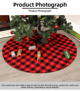 Detail of red and black buffalo plaid Christmas tree skirt on a cozy wooden floor