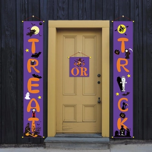 Outdoor porch display of Halloween trick or treat vertical banners in purple and orange