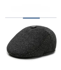 Detail showing the thick wool blend texture and stitching of the warm winter flat cap