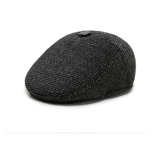 Macro side view of elderly men's tweed flat cap with warm thick lining and dark grey texture