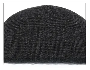 Macro shot of precise stitching and durable knit texture on the crown of a black winter cap