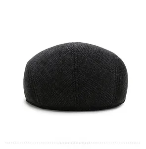 Rear view of elderly men's black wool blend newsboy cap with warm ear flaps and twill texture