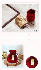 Detail of red and beige velvet wedding candy bags with gold Xi pendant and ribbon