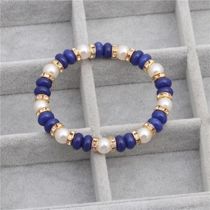 Blue lapis lazuli and 8mm white pearl beaded bracelet with gold rhinestone spacers