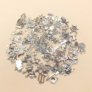 Mixed set of 100 silver alloy charms featuring animals and hearts for DIY jewelry making