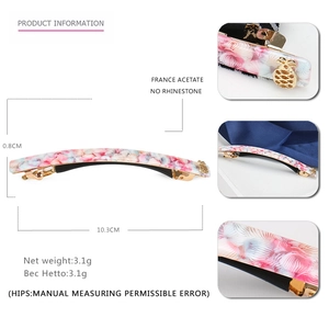 Detail view of 10.3cm geometric acetate hair clip with floral pattern and dimensions