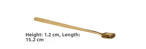 Detailed macro view of 15.2cm gold plated stainless steel mixing spoon with wooden handle