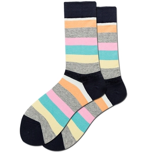 Macro detail of multicolored striped knitted crew socks featuring vibrant cotton textures