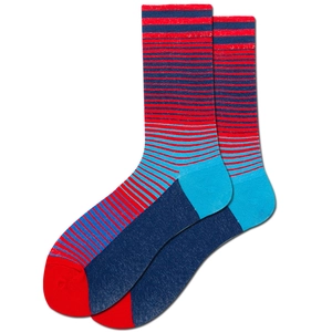 Detailed view of red and blue striped crew socks with contrast heel and toe knitting