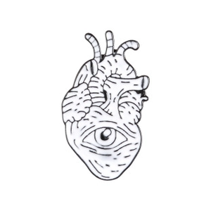 Detailed view of an anatomical heart enamel pin featuring a central eye design on metal