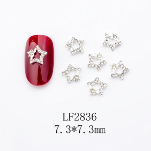 Macro view of 7.3mm star-shaped silver alloy nail rhinestones with hollow-out design
