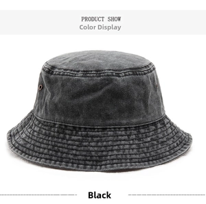 Detail view of washed denim bucket hat in black with metal eyelets and reinforced stitching