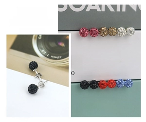 Macro detail of multi-colored Shamballa crystal stud earrings with S925 silver needles