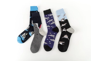 Detail view of four cotton shark socks in navy, grey, purple, and black on white background