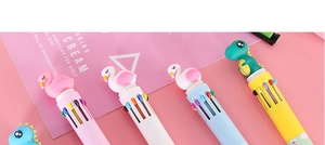 Detail of multi-color ballpoint pens with cute flamingo and dinosaur topper designs