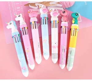 Close-up of multicolor 10-in-1 retractable ballpoint pens with cartoon unicorn toppers