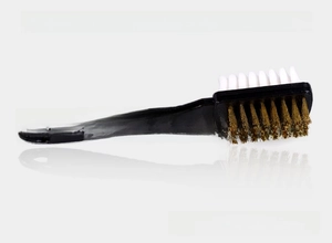 Detail of dual-sided shoe brush with copper wire and soft bristles for suede care