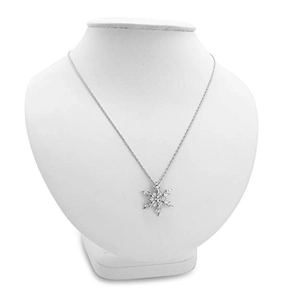 Elegant silver snowflake necklace with sparkling crystals on a white mannequin display