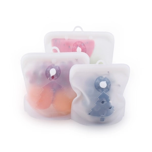 Three reusable silicone food storage bags in various sizes with clear volume markings