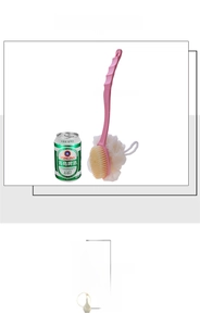 Detailed view of the dual-sided bath brush featuring soft bristles and a white mesh sponge