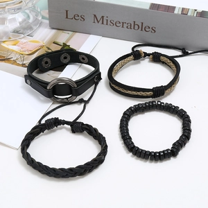 Retro black leather four-piece bracelet set with braided ropes and punk metal studs