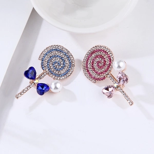 Lollipop brooch set with blue and pink rhinestones, crystals and pearls on white background